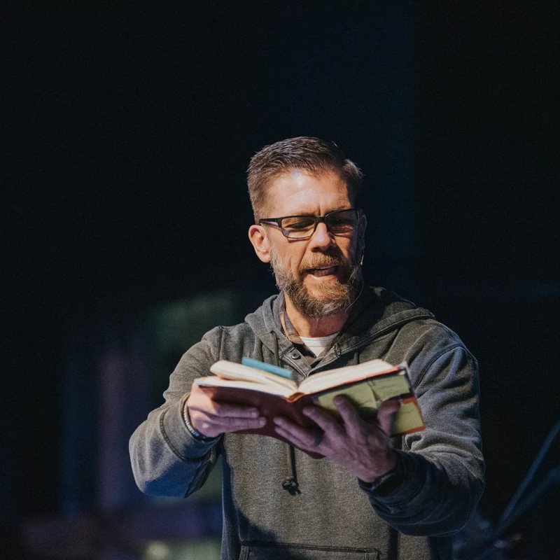 A Destination Church pastor teaching from an open Bible